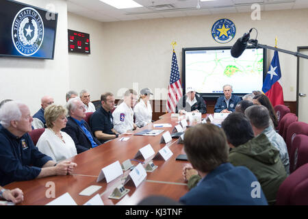 HOUSTON, TX - AUGUST 29: Texas Department of Public Safety Emergency Operations Center staff members listen as President Donald J. Trump and Texas Governor Greg Abbott address a briefing at the Texas Department of Public Safety Emergency Operations Center, Tuesday, August 29, 2017, in Austin, Texas, updating Hurricane Harvey relief and rescue efforts in southeastern Texas and southwestern Louisiana  People:  President Donald J. Trump and First Lady Melania Trump’ Stock Photo