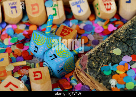 Dreidels for Hanukkah on wooden table Stock Photo