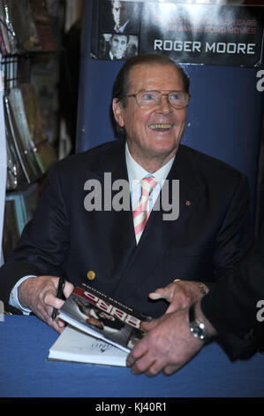 NEW YORK, NY - NOVEMBER 09:  Sir Roger Moore meets fans and signs copies of his book 'Bond on Bond' on November 9, 2012 in New York City.   People:  Sir Roger Moore Stock Photo