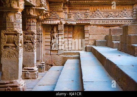 Carved idols on the inner wall of Rani ki vav, an intricately constructed step well. Patan in Gujarat, India. Stock Photo