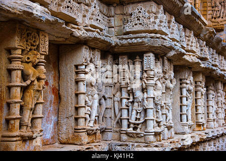 Carved idols on the inner wall and pillars of Rani ki vav, an intricately constructed step well. Patan in Gujarat, India. Stock Photo