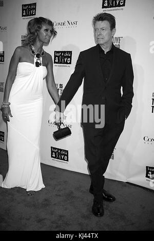 NEW YORK CITY, NY - NOVEMBER 13:  David Bowie and Iman inside Keep A Child Alive's 5th annual Black Ball at Hammerstein Ballroom on November 13, 2008 in New York City.   People:  David Bowie,  Iman Stock Photo