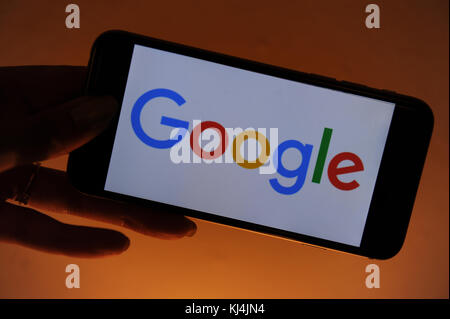 The Google logo seen on an iphone screen Stock Photo