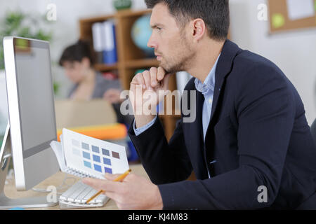 designers working at desk in modern office Stock Photo