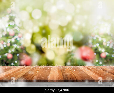 Premium Photo  Wooden tabletop with cutting board and blurred kitchen with  christmas tree background for display or montage your products