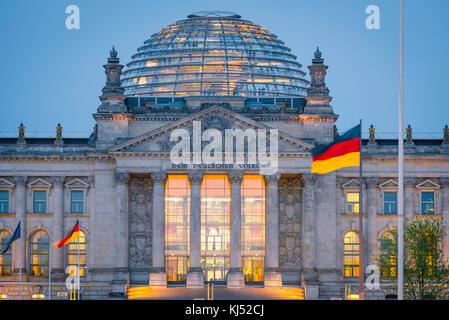 Reichstag Berlin, view at dusk of the Reichstag parliament building exterior with its glass dome and atrium illuminated, Berlin, Germany. Stock Photo