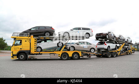 TURKU, FINLAND - JULY 12, 2015: Volvo FM car carrier hauls new cars. A scrapping scheme for old vehicles will be carried out in Finland between 1 July Stock Photo