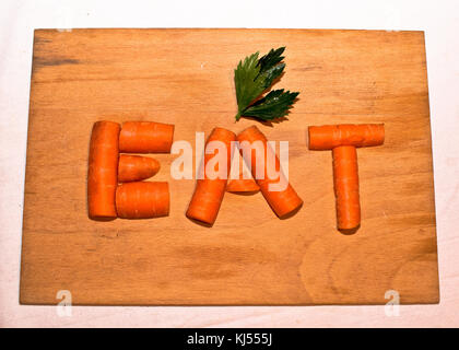 carrots on wooden board Stock Photo