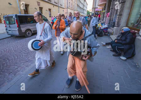 Members of Hare Krishna movement singing on the Old Town of Lviv city, largest city in western Ukraine Stock Photo