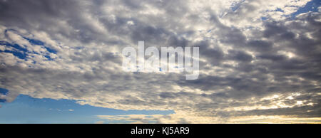 Heavy and huge clouds at sunset. A storm is ready to begin. Stock Photo