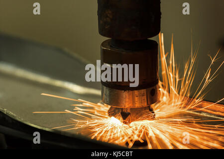 Close-up auto spot welding machine is welding nut to car part Stock Photo