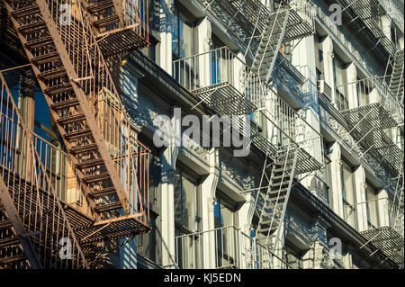 Architectural detail view of cast iron fire escapes in New York City Stock Photo