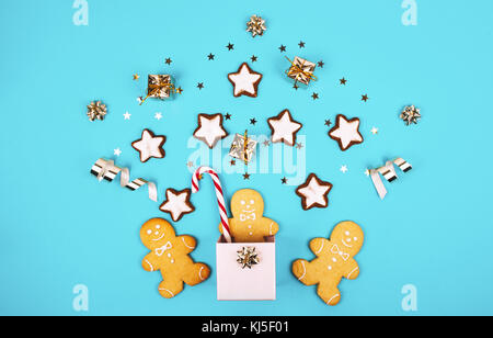 Christmas composition with gingerbread man in a pink box. Flat lay style. Stock Photo