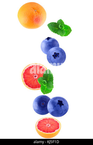 Isolated flying berriesgrapefruit and mint on white background with clipping path Stock Photo