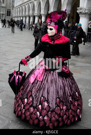 Costumed attendee at the Venice Carnival (Carnevale di Venezia), an annual festival held in Venice, Italy. Started to recall a victory of the 'Serenissima Repubblica' against the Patriarch of Aquileia, in the year 1162. Stock Photo