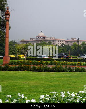 View from Rajpath Marg to India Gate, Delhi India. Rajpath (meaning 'King's Way') is a ceremonial boulevard in New Delhi, India, that runs from Rashtrapati Bhavan on Raisina Hill through Vijay Chowk and India Gate to the National Stadium. The avenue is lined on both sides by huge lawns, canals and rows of trees. It was designed by Edward Lutyens Stock Photo