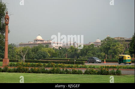 View from Rajpath Marg to India Gate, Delhi India. Rajpath (meaning 'King's Way') is a ceremonial boulevard in New Delhi, India, that runs from Rashtrapati Bhavan on Raisina Hill through Vijay Chowk and India Gate to the National Stadium. The avenue is lined on both sides by huge lawns, canals and rows of trees. It was designed by Edward Lutyens Stock Photo