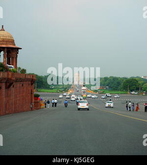 View from Rajpath Marg to India Gate, Delhi India. Rajpath (meaning 'King's Way') is a ceremonial boulevard in New Delhi, India, that runs from Rashtrapati Bhavan on Raisina Hill through Vijay Chowk and India Gate to the National Stadium. The avenue is lined on both sides by huge lawns, canals and rows of trees. It was designed by Edward Lutyens Stock Photo