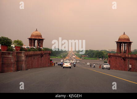 View from Rajpath Marg to India Gate, Delhi India. Rajpath (meaning 'King's Way') is a ceremonial boulevard in New Delhi, India, that runs from Rashtrapati Bhavan on Raisina Hill through Vijay Chowk and India Gate to the National Stadium. The avenue is lined on both sides by huge lawns, canals and rows of trees. It was designed by Edward Lutyens Stock Photo