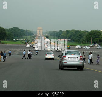 View from Rajpath Marg to India Gate, Delhi India. Rajpath (meaning 'King's Way') is a ceremonial boulevard in New Delhi, India, that runs from Rashtrapati Bhavan on Raisina Hill through Vijay Chowk and India Gate to the National Stadium. The avenue is lined on both sides by huge lawns, canals and rows of trees. It was designed by Edward Lutyens Stock Photo