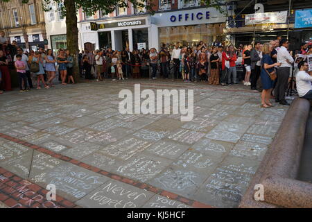 Tributes written on the ground, during the days following the 22 May 2017, suicide bombing, carried out at Manchester Arena in Manchester, England, following a concert by American singer Ariana Grande. Stock Photo