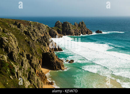Looking from Treen Cliffs across to Logan Rock near Porthcurno Cornwall Stock Photo