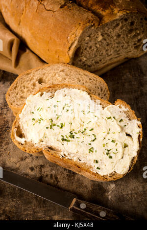 Chive and cheese cream on the slice of bread Stock Photo