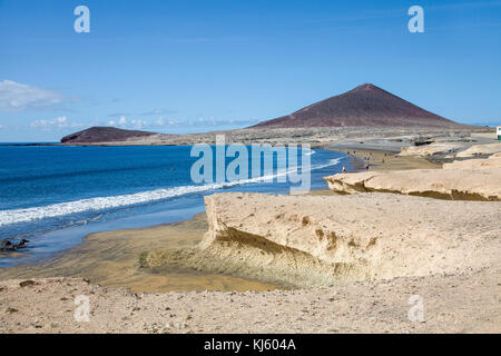 Beach of El Medano and Montana Roja, a popular surfer destination on Tenerife island, Canary islands, Spain Stock Photo