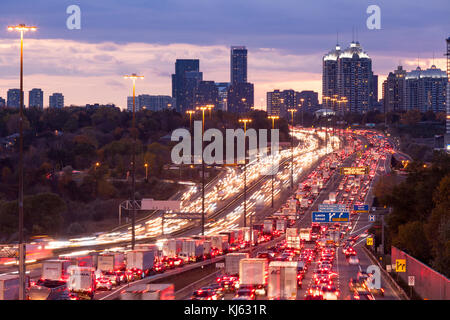 Traffic Congestion along the King's Highway 401 at dusk in Toronto, Ontario, Canada. Stock Photo