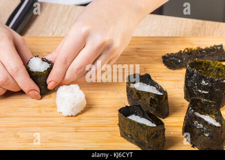 Japanese chef. Chef prepares rolls, hands closeup Stock Photo