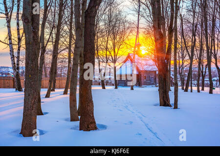 Russian church in winter forest Stock Photo