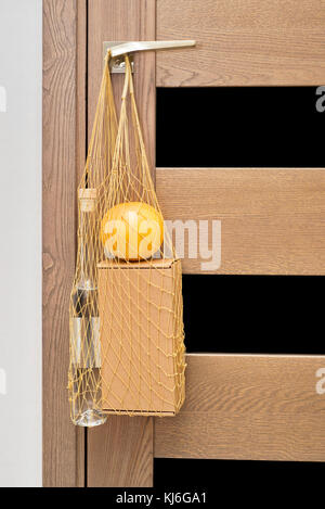 Mesh bag full of gift set for hipsters Stock Photo