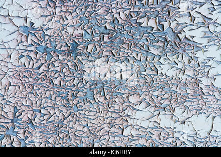 Texture from peeling layer of flaked old paint. Artistic background with beautiful random pattern. Stock Photo