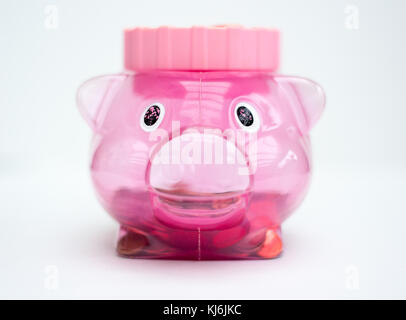Pink piggy bank on white background Stock Photo