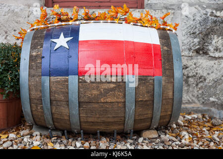 Wooden oak barrel with Texas flag painted on/ Decorative oak barrel in front of winery Stock Photo