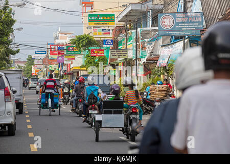 Cycle rickshaws / becak for public transport in the city Yogyakarta, Java, Indonesia Stock Photo