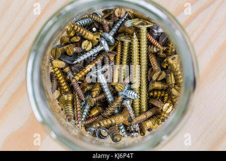 Glass jar of mixed screws Stock Photo