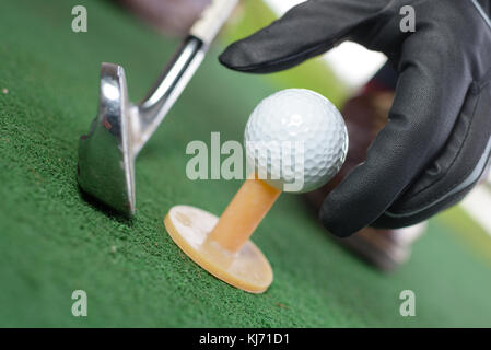 close up golf ball on tee Stock Photo