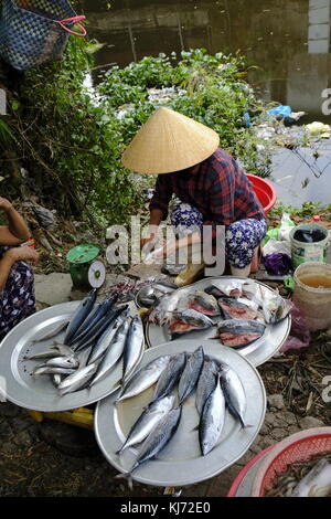 Asian market sellers vending fish Stock Photo