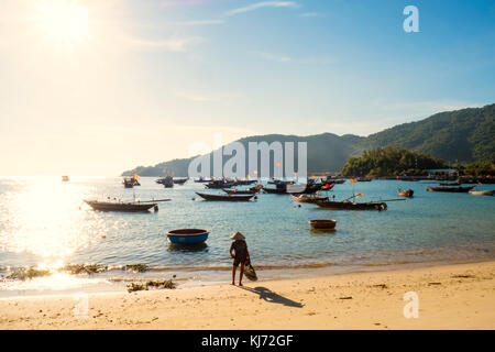 fishing boats off the beach on the Cham Islands in Vietnam Stock Photo