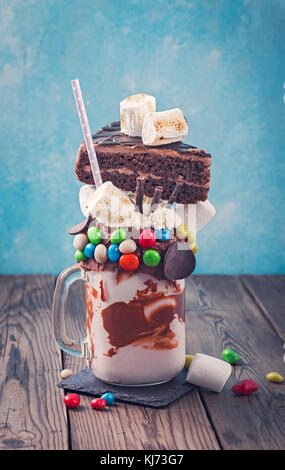 Monster milkshake on table Stock Photo