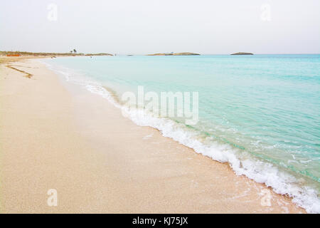 FORMENTERA, BALEARIC ISLANDS, SPAIN - OCTOBER 25, 2016: Dreamy soft paradise beach with crystal clear water on an overcast day on October 25, 2016 in  Stock Photo