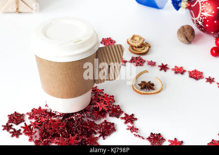 A paper cup of coffee, peppermint mocha, displayed with christmas decorations on white background Stock Photo