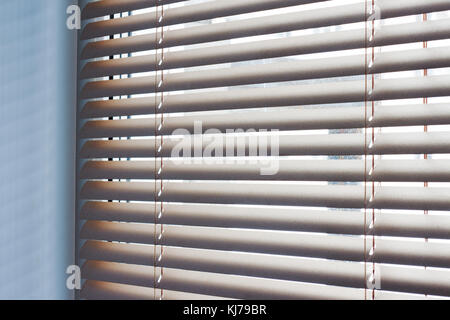 Sunlight coming through venetian blinds by the window Stock Photo