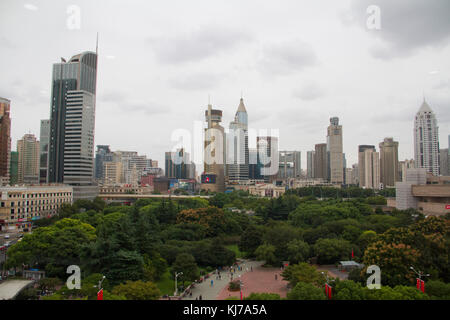 People walk through People's Square Park in central Shanghai, China. Stock Photo