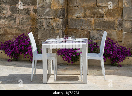 Beautifully white  served table with flowers Stock Photo