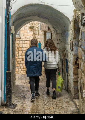 Two women walking through archway, Safed, Northern District, Israel Stock Photo