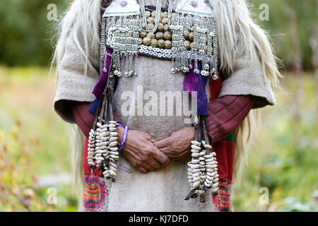 Hands of Aryan woman in traditional dress, Dah Hanu, Ladakh; Jammu and Kashmir, India. Stock Photo