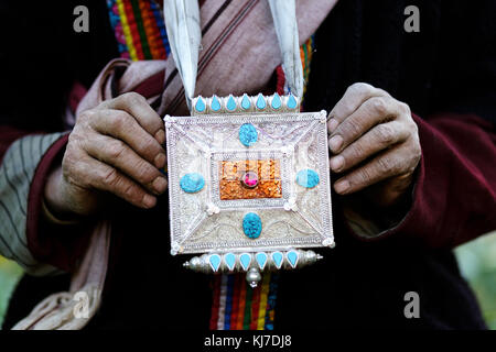 Elder Aryan man in traditional dress standing in the field, Dah Hanu, Ladakh; Jammu and Kashmir, India. Stock Photo