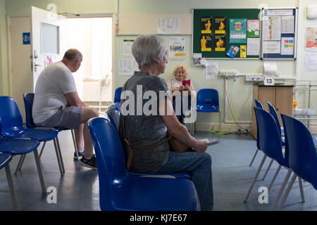 NHS  waiting room- patients waiting,Surrey,UK Stock Photo